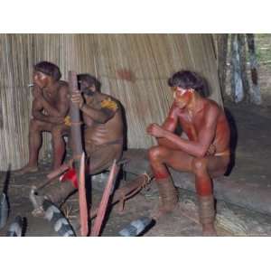 Kamayura Indians Playing Flutes Inside Hut, Xingu Area, Brazil, South 