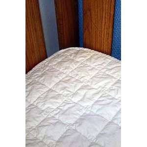    Coyuchi Quilted Organic Cotton Crib Pad, flat underlay. Baby