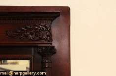   mantel and surround from about 1895 has baronial scale deeply sculpted