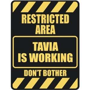   RESTRICTED AREA TAVIA IS WORKING  PARKING SIGN