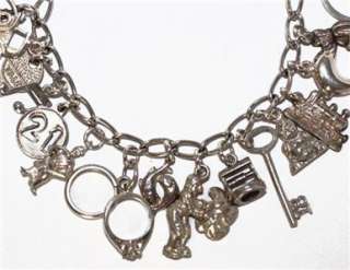 LOADED VINTAGE STERLING SILVER CHARM BRACELET WITH 25 CHARMS  
