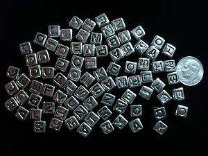 85 Pcs Silver tone alphabet letter cube beads. Silver colored plastic 