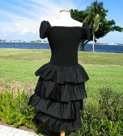 OFF THE SHOULDER UPPER BODICE AND RUFFLED SKIRT GIVE THIS DRESS A 