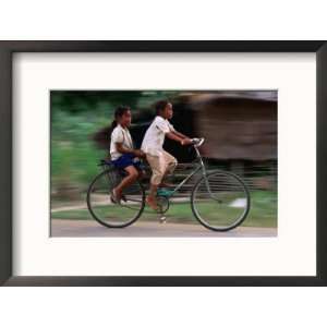 Young Girls Riding Bikes to the Village School in Bavel, Battambang 