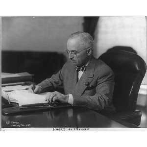  Harry S. Truman,1884 1972,seated at desk,pen,papers