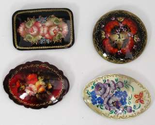 These 4 beautiful brooches are hand painted on a papier mache body 