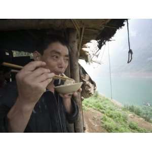  Ethnic Miao Villager Eats Noodles Along the Yangtze River 