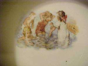 BABYS FEEDING DISH, GIRLS SWIMMING, GERMANY  