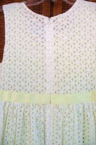 White daisy eyelet cotton fabric Underskirt is a pale lime that peaks 